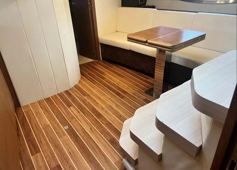Slide: The Image of Interior of 2011 Azimut Atlantis 40 yacht with wooden flooring and seating area. - 9