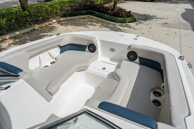 Slide: The Image of 2025 Hurricane SunDeck 2050 OB boat interior with spacious seating and cup holders. - 11