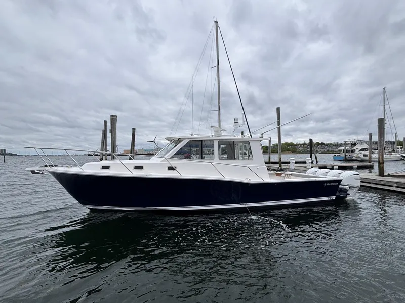 The Image of 2026 NorthCoast 415 HT boat docked in a marina under cloudy skies. - 0