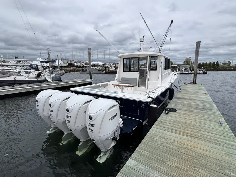 Slide: The Image of 2026 NorthCoast 415 HT boat docked, featuring four Yamaha 300 engines. - 1
