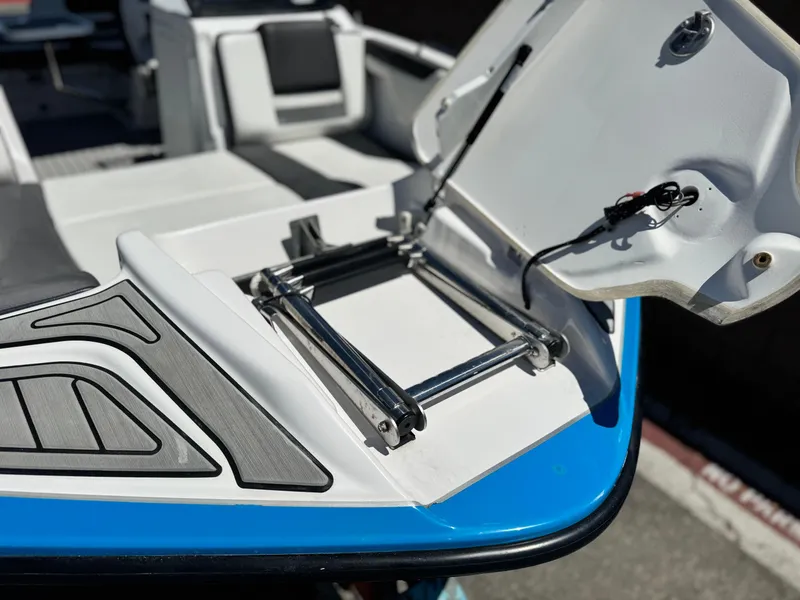 Slide: The Image of 2021 Yamaha SX210 boat with open hatch and ladder on deck. - 10