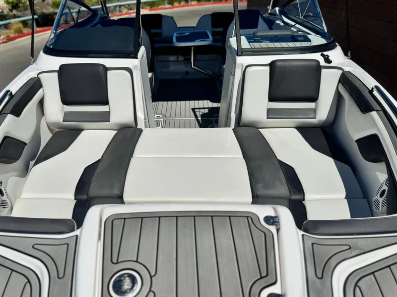 Slide: The Image of 2021 Yamaha Boats SX210 interior with sleek seating and modern design. - 11