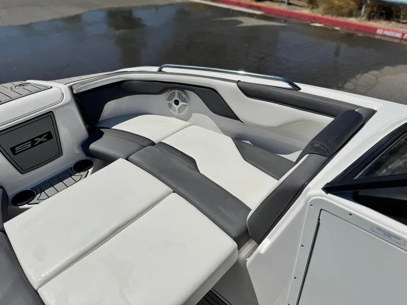Slide: The Image of 2021 Yamaha Boats SX210 interior seating with sleek design and comfortable upholstery. - 15