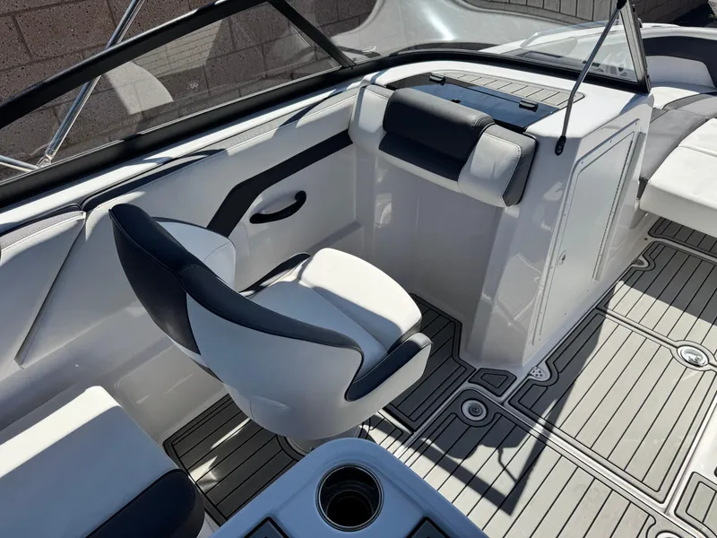 Slide: The Image of 2021 Yamaha Boats SX210 interior with sleek seating and modern design. - 26