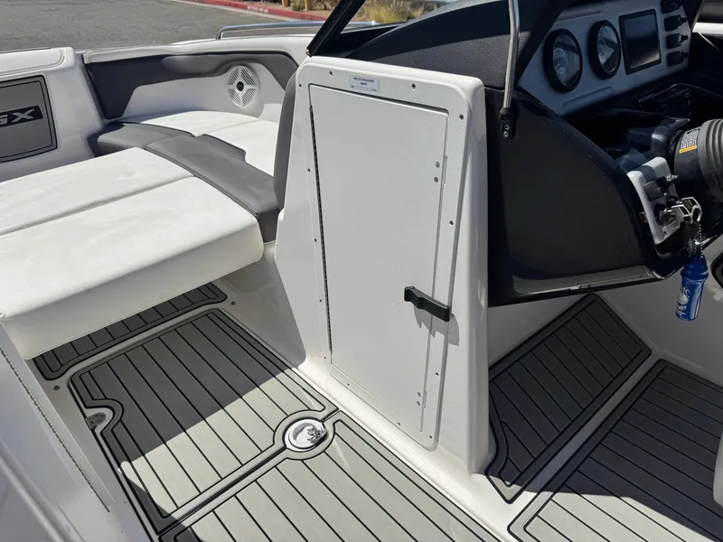Slide: The Image of 2021 Yamaha SX210 boat interior with seating and dashboard details. - 27