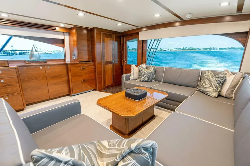 Slide: The Image of Luxurious interior of 2023 Viking 80 Convertible yacht with elegant wood finishes and ocean view. - 10