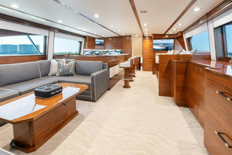Slide: The Image of Luxurious interior of 2023 Viking 80 Convertible yacht with elegant wood finishes and modern furnishings. - 13
