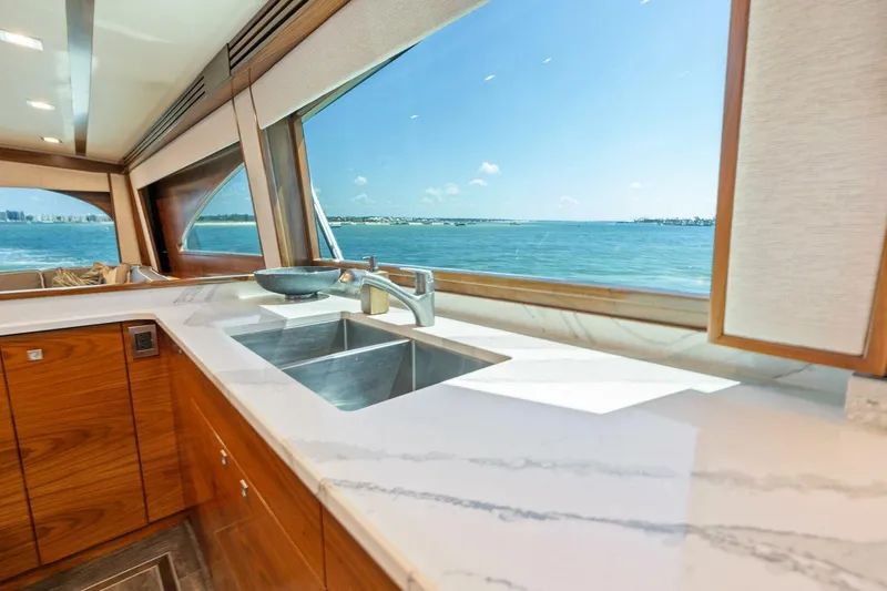 Slide: The Image of Luxurious kitchen interior of 2023 Viking 80 Convertible yacht with ocean view. - 18