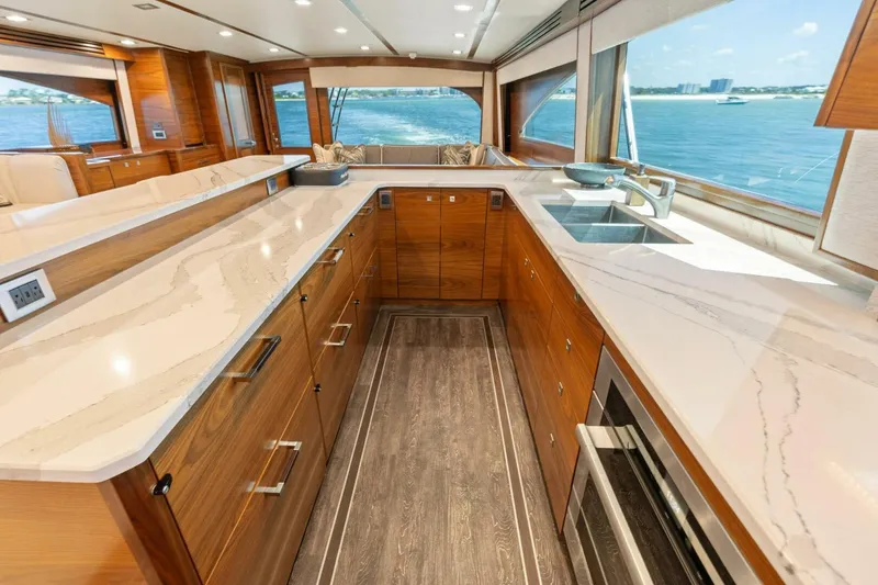 Slide: The Image of Luxurious kitchen interior of 2023 Viking 80 Convertible yacht with ocean view. - 19