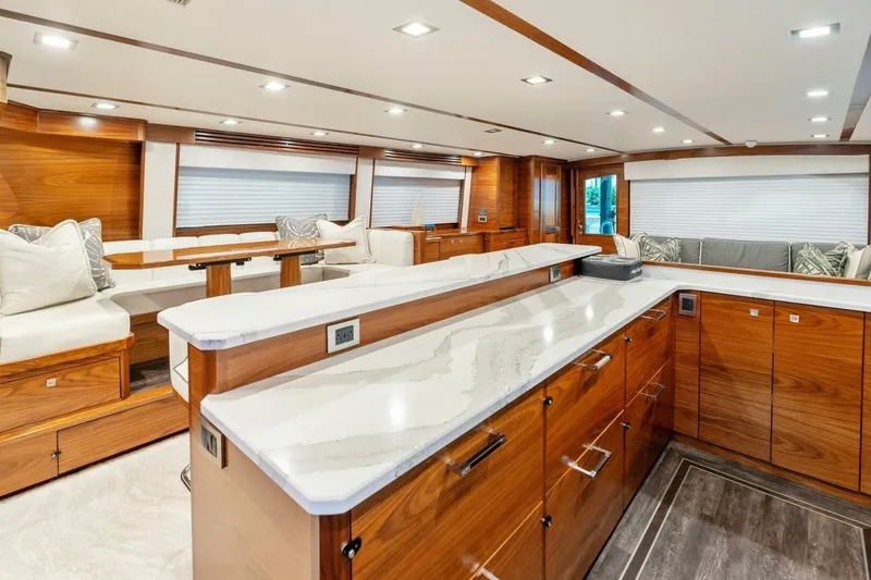 Slide: The Image of Luxurious interior of 2023 Viking 80 Convertible yacht with elegant wood finishes and modern design. - 21