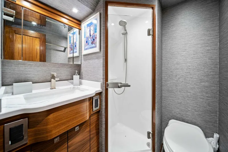 Slide: The Image of Luxurious bathroom in 2023 Viking 80 Convertible yacht with modern fixtures and elegant design. - 38