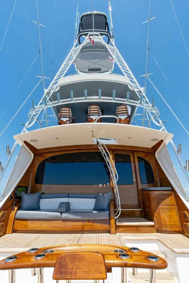 Slide: The Image of 2023 Viking 80 Convertible yacht, luxurious deck view with seating and tower. - 44