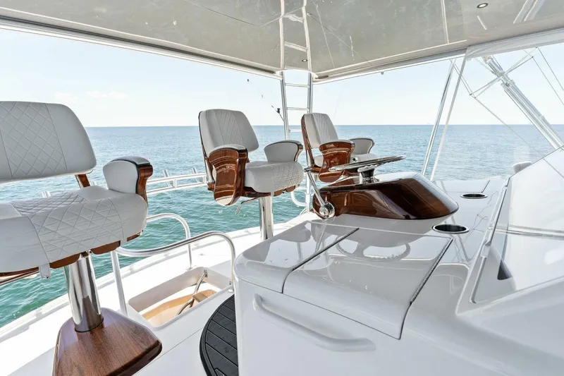 Slide: The Image of Luxurious 2023 Viking 80 Convertible yacht interior with elegant seating and ocean view. - 46