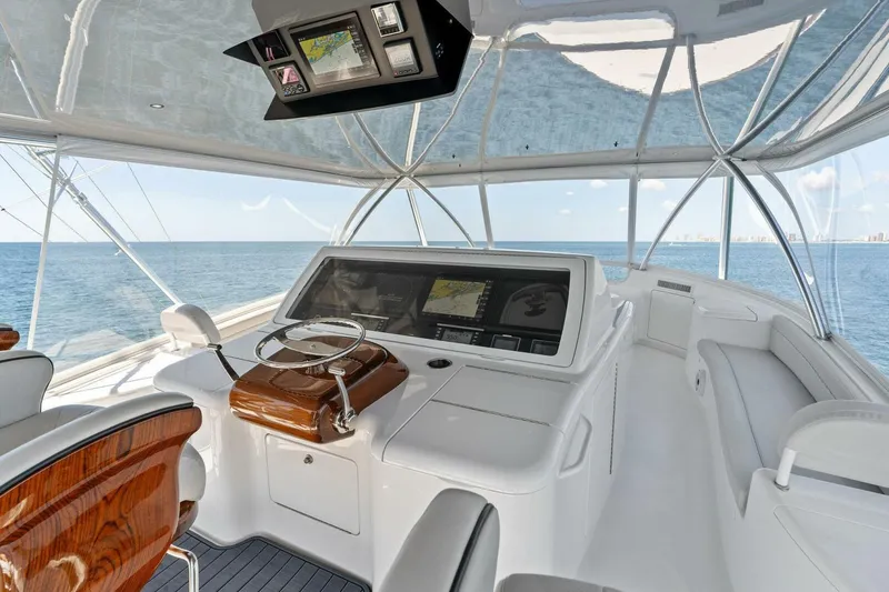 Slide: The Image of Luxurious helm of 2023 Viking 80 Convertible yacht with ocean view. - 48