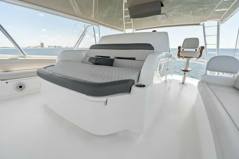 Slide: The Image of Luxurious seating on 2023 Viking 80 Convertible yacht, featuring modern design and ocean views. - 6