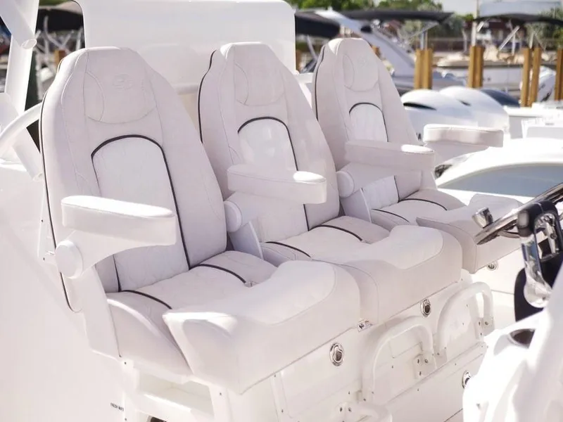 Slide: The Image of Luxury seating on 2021 Sea Fox 328 Commander boat, featuring plush white upholstery. - 1