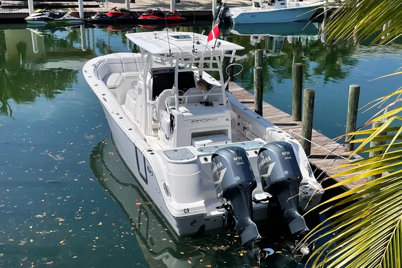 Slide: The Image of 2021 Sea Fox 328 Commander boat docked with twin Yamaha V8 engines. - 10