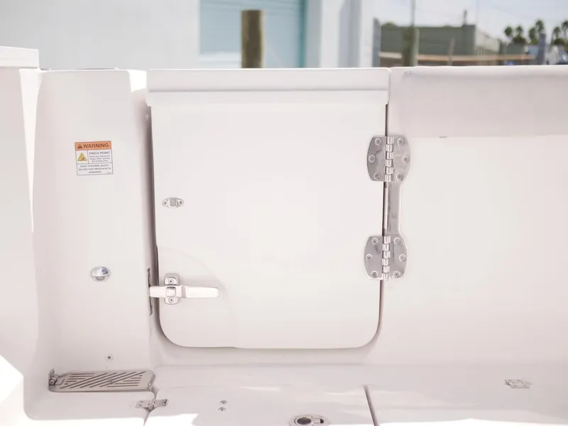 Slide: The Image of 2021 Sea Fox 328 Commander boat hatch with stainless steel hinges and warning label. - 8