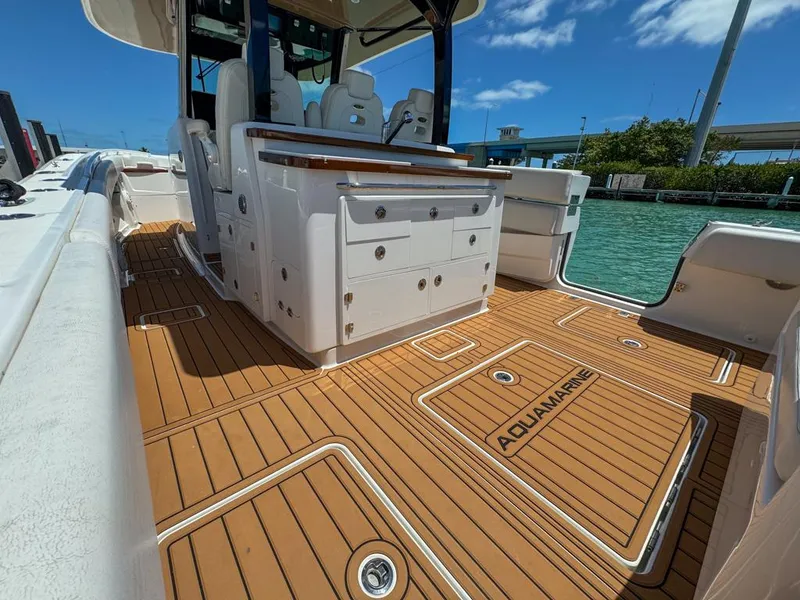 Slide: The Image of 2019 HCB 39 Speciale boat interior with teak flooring and seating. - 13