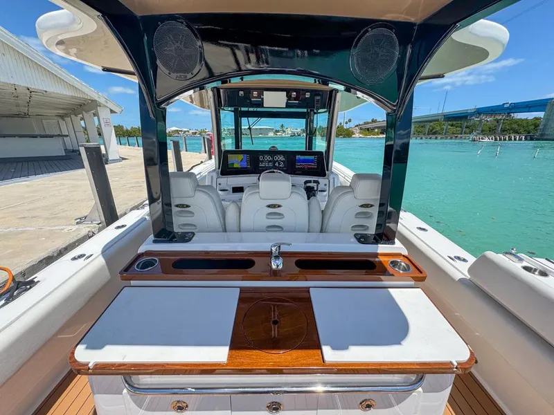 Slide: The Image of 2019 HCB 39 Speciale boat interior with luxurious seating and modern dashboard. - 19