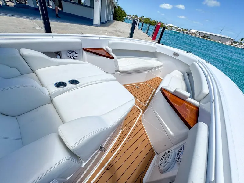 Slide: The Image of Luxurious 2019 HCB 39 Speciale boat interior with white seating and wooden accents. - 22