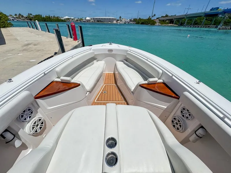 Slide: The Image of 2019 HCB 39 Speciale boat interior with white seating and wooden accents. - 23