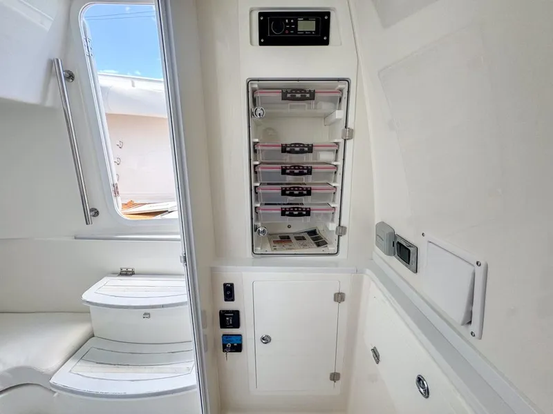 Slide: The Image of Interior of 2019 HCB 39 Speciale boat with control panel and seating area. - 28