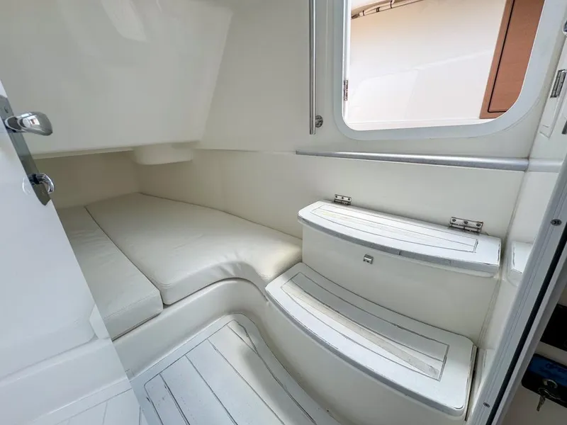 Slide: The Image of 2019 HCB 39 Speciale cabin interior with white seating and window. - 29
