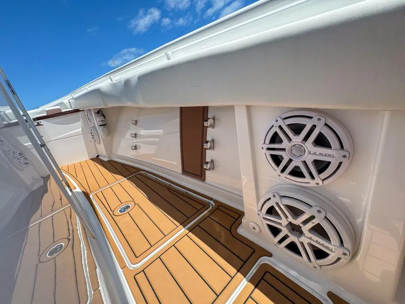 Slide: The Image of 2019 HCB 39 Speciale boat interior with speakers and teak flooring. - 34