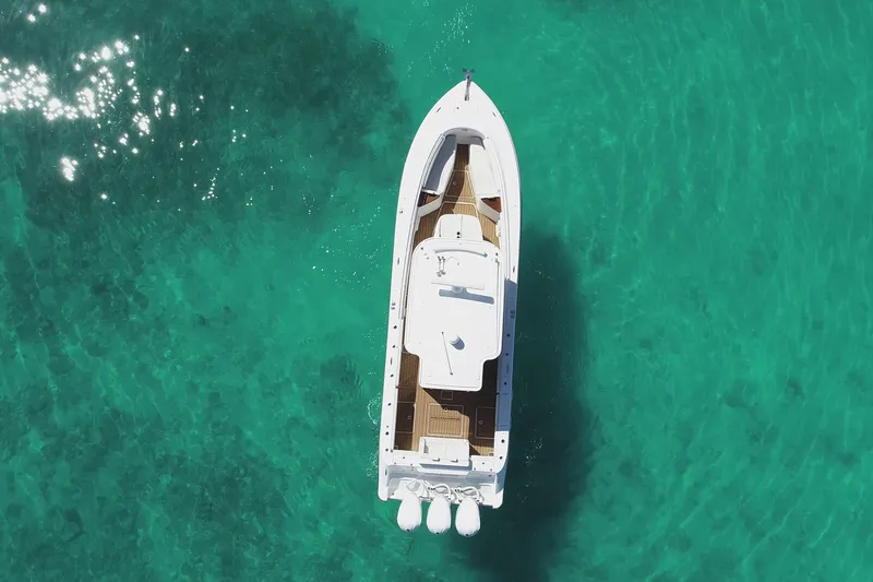 Slide: The Image of Aerial view of 2019 HCB 39 Speciale boat on clear turquoise water. - 39
