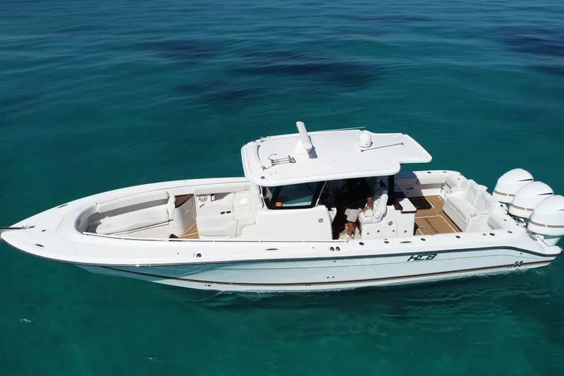 Slide: The Image of 2019 HCB 39 Speciale boat cruising on clear blue water. - 40