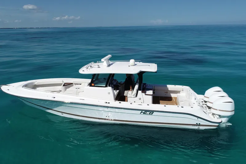 Slide: The Image of 2019 HCB 39 Speciale boat on clear blue ocean water. - 41