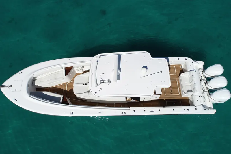 Slide: The Image of Aerial view of 2019 HCB 39 Speciale boat on clear turquoise water. - 42