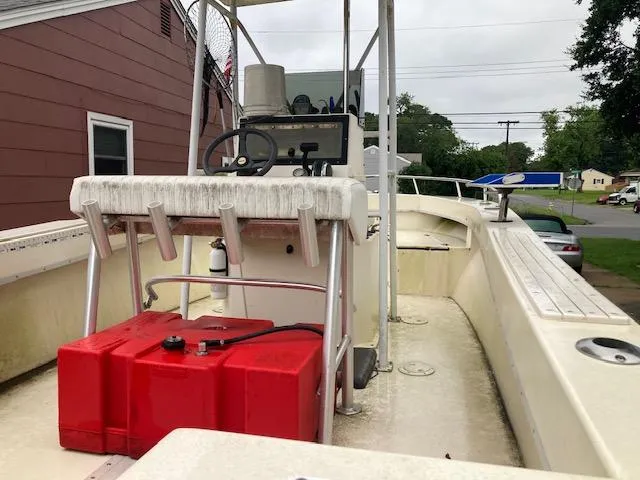 Slide: The Image of 1995 KenCraft Challenger 190 boat with red fuel tank and steering console. - 4