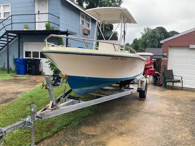 Slide: The Image of 1995 KenCraft Challenger 190 boat on trailer in residential driveway. - 7