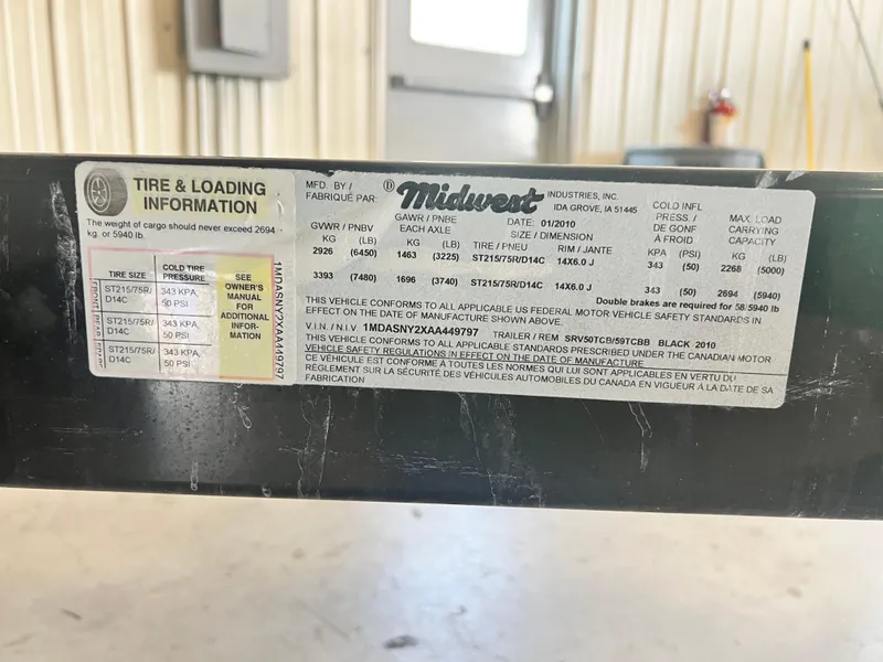 Slide: The Image of Tire and loading information label on Midwest trailer, 2010 Sea Ray 220 Sundeck. - 14