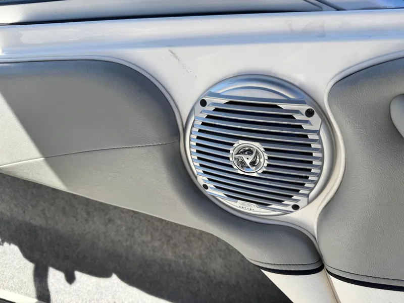 Slide: The Image of Speaker on a 2012 Bayliner 215 boat interior, featuring sleek design and metallic finish. - 23
