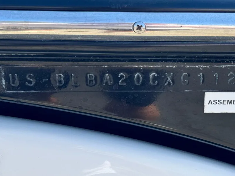 Slide: The Image of 2012 Bayliner 215 boat hull identification number (HIN) close-up. - 25