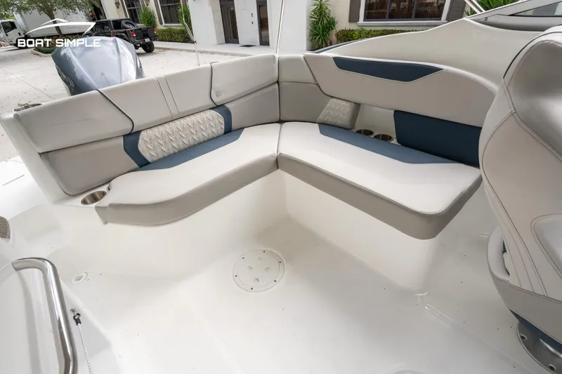 Slide: The Image of 2025 Hurricane SunDeck 2400 OB boat interior with cushioned seating and modern design. - 8