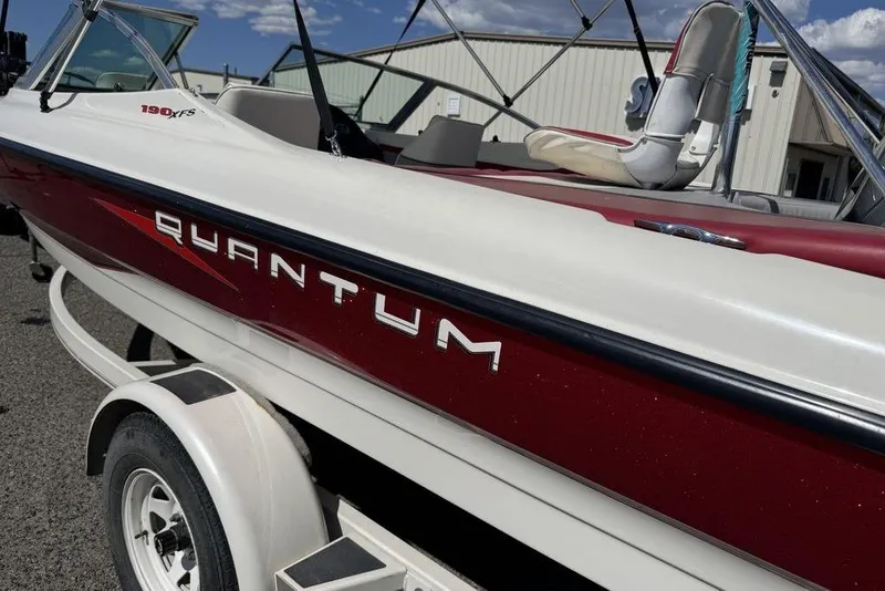 Slide: The Image of 1997 Bayliner Quantum 190 XFS boat on trailer, red and white exterior. - 11