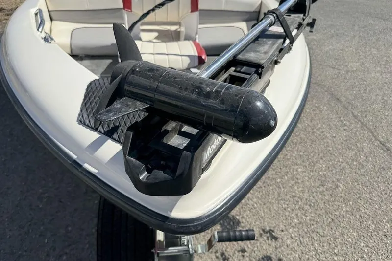 Slide: The Image of 1997 Bayliner Quantum 190 XFS boat with trolling motor on bow, white interior. - 12