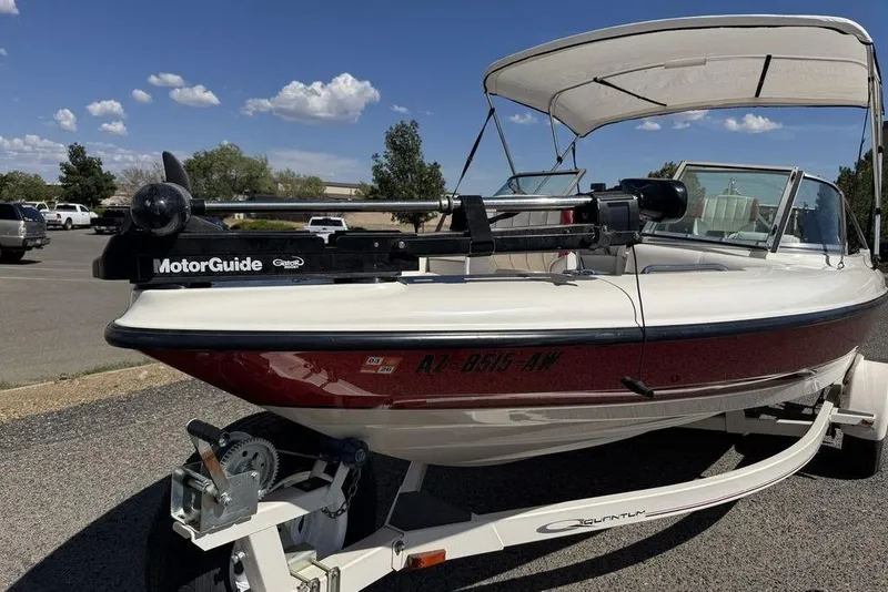 Slide: The Image of 1997 Bayliner Quantum 190 XFS boat with MotorGuide trolling motor on trailer. - 13