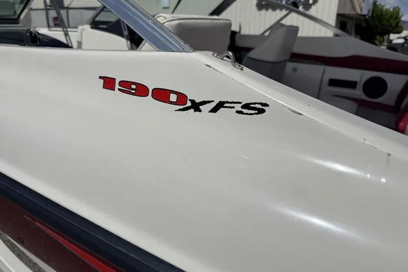 Slide: The Image of 1997 Bayliner Quantum 190 XFS boat detail with red and black lettering. - 14