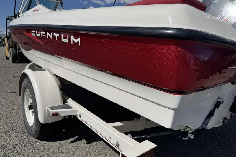 Slide: The Image of 1997 Bayliner Quantum 190 XFS boat on trailer, red and white exterior. - 17