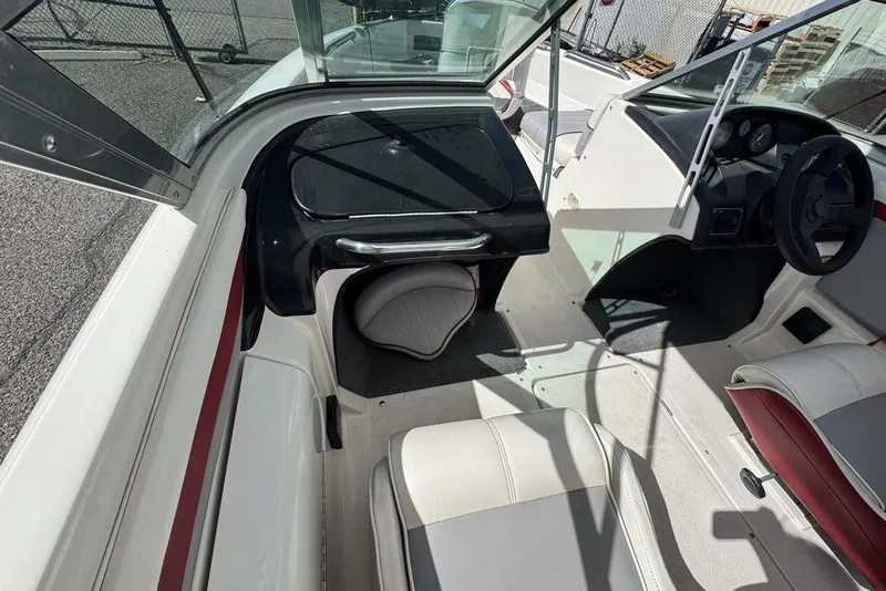 Slide: The Image of 1997 Bayliner Quantum 190 XFS boat interior with seating and steering wheel. - 25