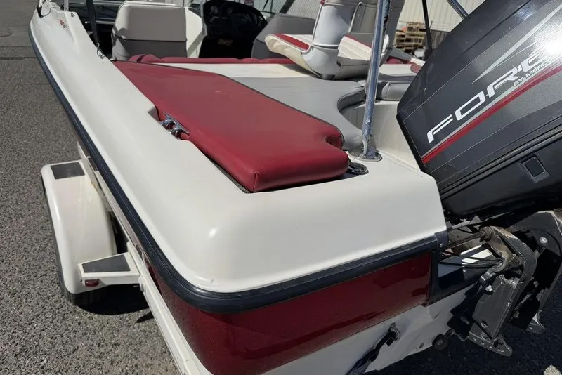 Slide: The Image of 1997 Bayliner Quantum 190 XFS boat with red and white seating, Force outboard motor. - 3