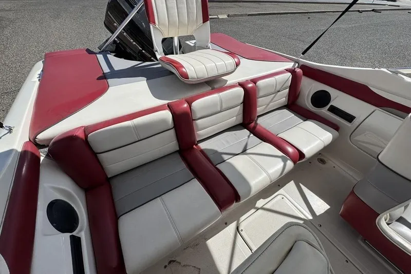 Slide: The Image of 1997 Bayliner Quantum 190 XFS boat interior with red and white seating. - 33