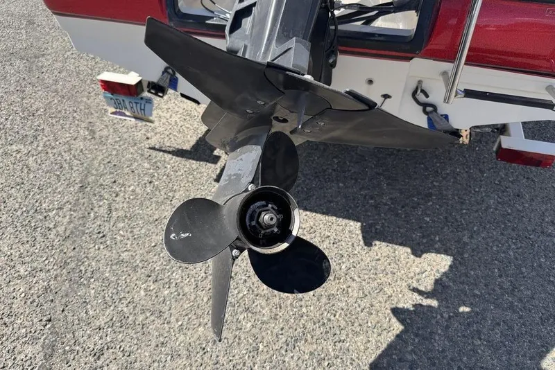 Slide: The Image of Propeller of a 1997 Bayliner Quantum 190 XFS boat on a trailer. - 5