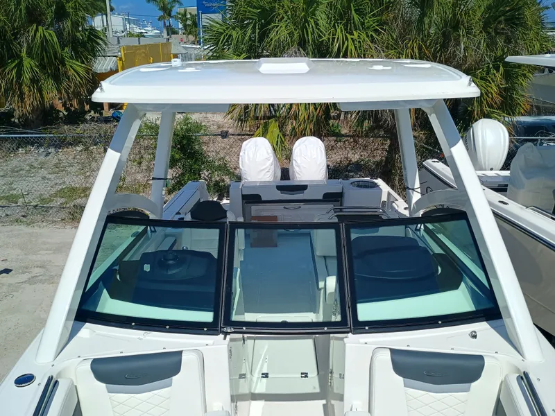 Slide: The Image of 2025 Robalo R257 Dual Console boat with sleek design and spacious seating. - 28