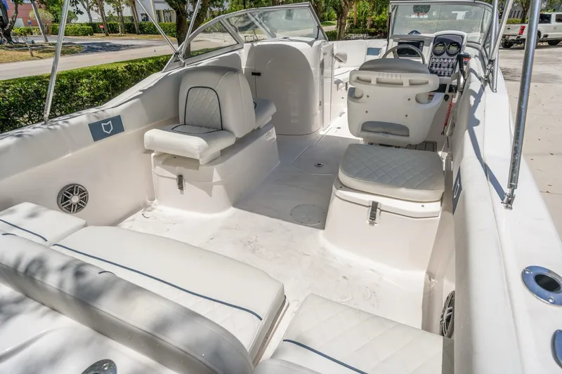 Slide: The Image of 2025 Sea Fox 228 Traveler boat interior with white seating and modern dashboard. - 11